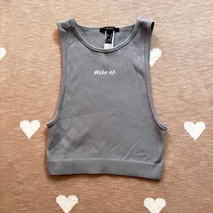 this item is a stretchy ribbed tank top from forever 21 in a size M